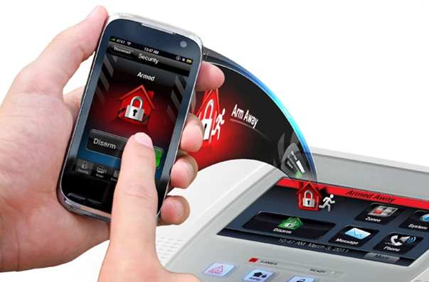 A Commercial Fire and Security customer setting their home alarm with their cell phone.